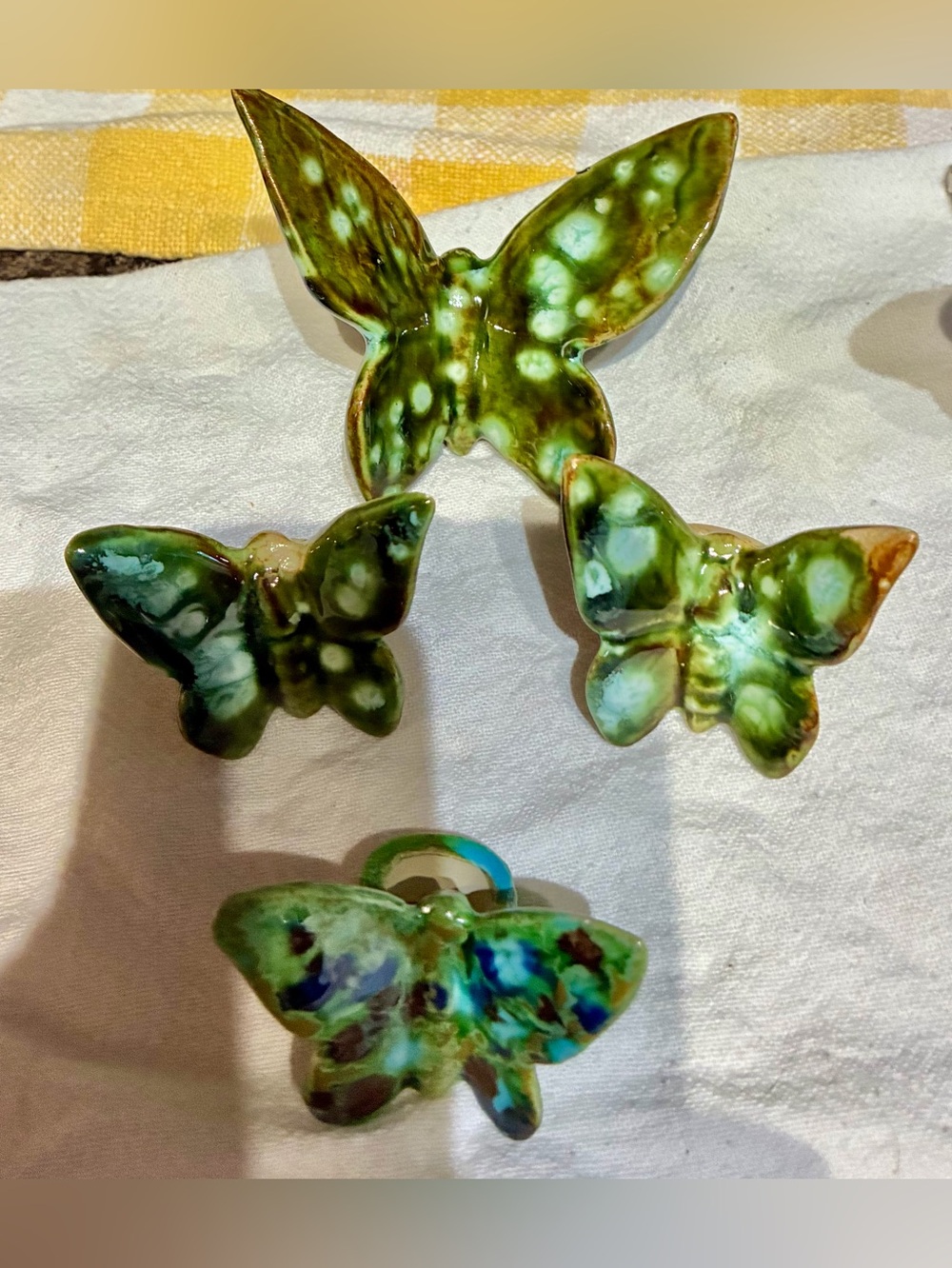 Ceramic Handpainted Butterfly ornaments/napkin holders. 7 sets of 3-5 colors.